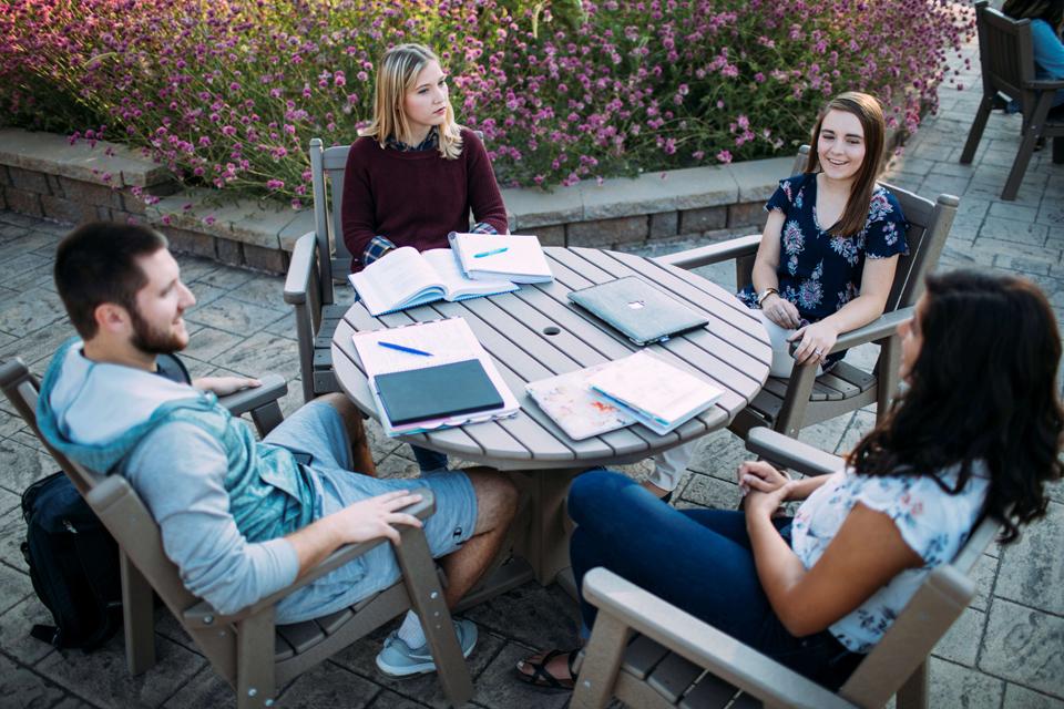 Students sitting at outdoor table