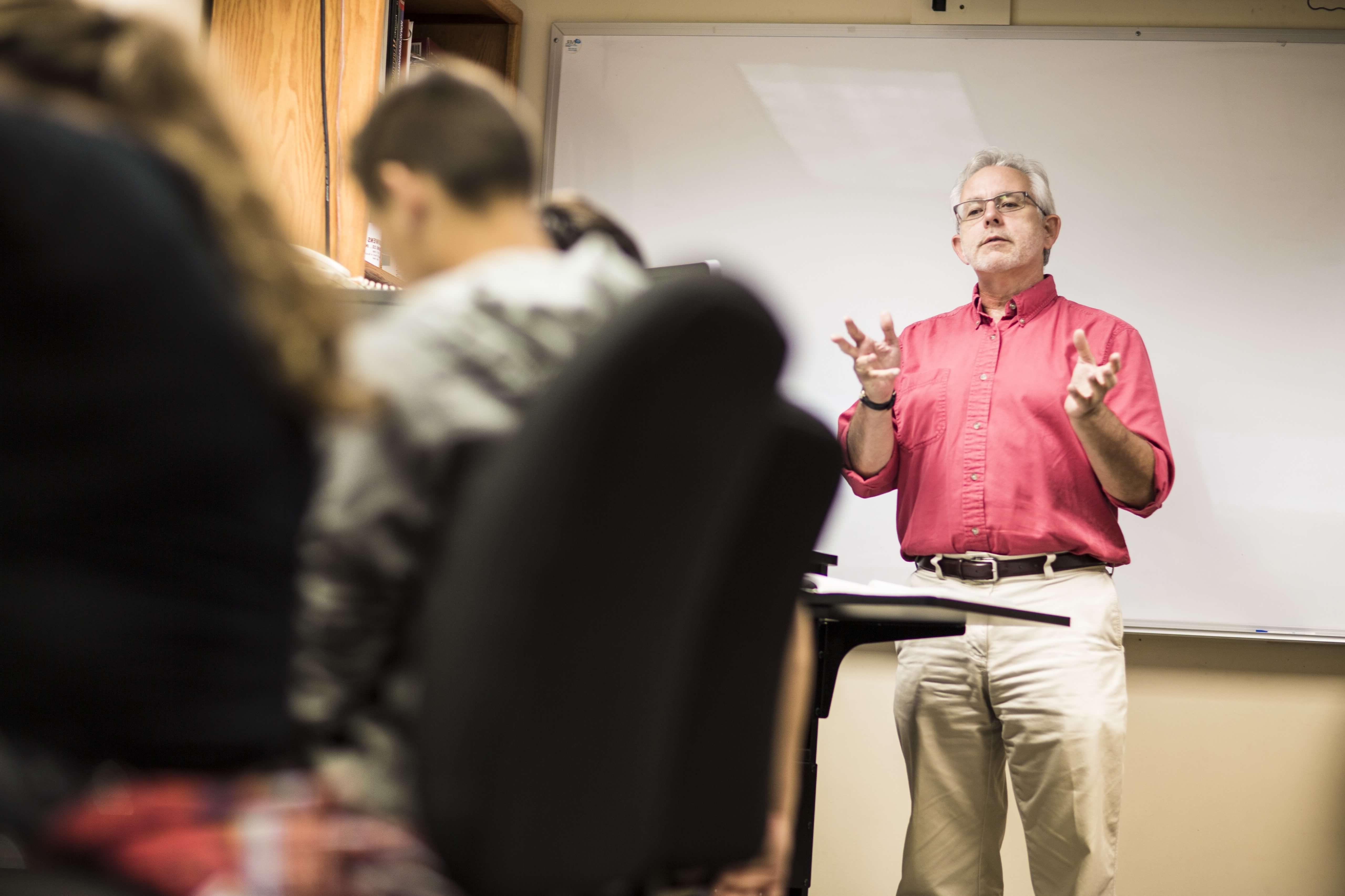 Instructor in red shirt